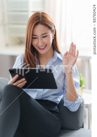 Beautiful asian woman using video call application. blogger, video conference, comfortable usage concept. 98760424