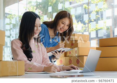 Asian small business owner working together with friend at home office. Business retail market and online sell marketing delivery, SME e-commerce concept. 98760471