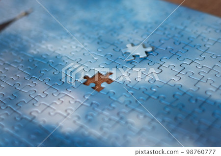The last piece of jigsaw puzzle concept for solutions and completion The last piece of jigsaw puzzle concept for solutions and completion 98760777