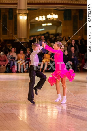 Attractive young couple of children dancing ballroom dance. Girl and boy dancer international dancing. Attractive young couple of children dancing ballroom dance. Girl and boy dancer international dancing. 98760820