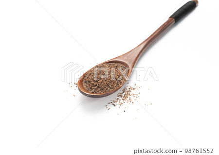 isolated himalayan black salt, Kala Namak on wooden sppon, cooling spice ayurvedic Indian Asian cuisine, healthy food. Kiln-fired rock salt with a sulphurous, pungent smell.White background.Horizontal 98761552