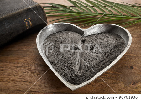 Ash wednesday, crucifix made of ash, dust as christian religion. Lent beginning 98761930