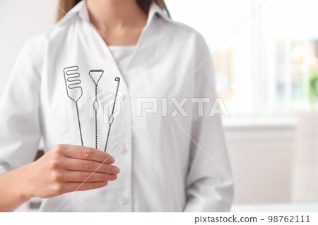 Speech therapist with logopedic probes in clinic, closeup. Space for text Speech therapist with logopedic probes in clinic, closeup. Space for text 98762111