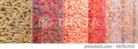 Multi-colored gummy candies background 98762430