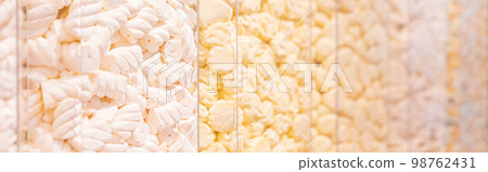 Pastel yellow marshmallows in a shop window Pastel yellow marshmallows in a shop window 98762431
