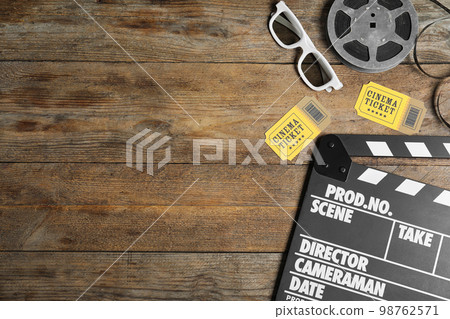 Flat lay composition with clapperboard, cinema tickets and 3d glasses on wooden table 98762571