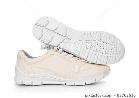leather sneakers with lacing and perforated sole on a white background. leather sneakers with lacing and perforated sole on a white background. 98762636