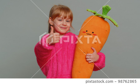 Happy preteen child girl kid looking approvingly at camera showing thumbs up, like positive sign 98762865