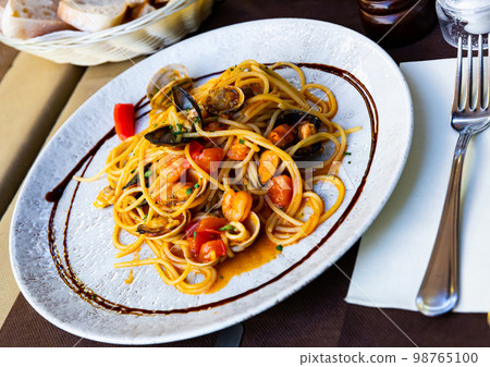Plate of pasta with seafood Plate of pasta with seafood 98765100