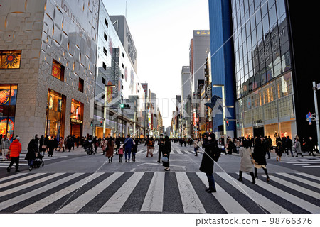 People walking on Ginza-dori, a pedestrian mall 98766376