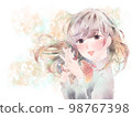 A girl who folds her hands in front of her chest / smile / yellow background 98767398