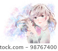 A girl who folds her hands in front of her chest / crying face / pastel background 98767400