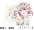A girl who folds her hands in front of her chest / smile / pastel background 98767403