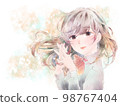 A girl who folds her hands in front of her chest/smile/yellow background 98767404