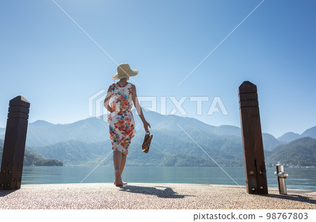 traveling Asian woman at Sun Moon Lake 98767803