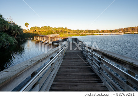 Elevated boardwalk at Green Cay Nature Center Wetlands in Boynton Beach. Elevated boardwalk at Green Cay Nature Center Wetlands in Boynton Beach. 98769281