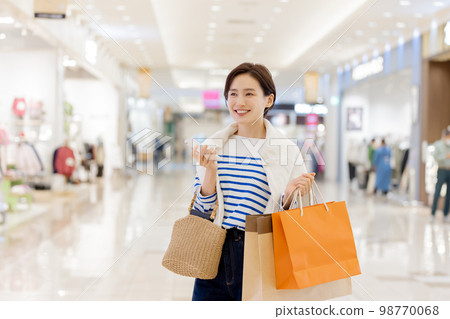 Woman satisfied with explosive shopping Woman satisfied with explosive shopping 98770068