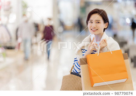 Woman satisfied with explosive shopping Woman satisfied with explosive shopping 98770074