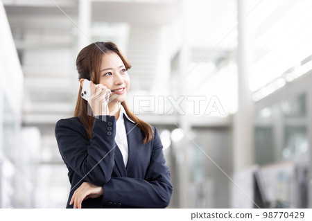 Business woman speaking on smartphone 98770429