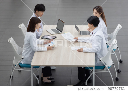 Medical staff having a meeting Medical staff having a meeting 98770781