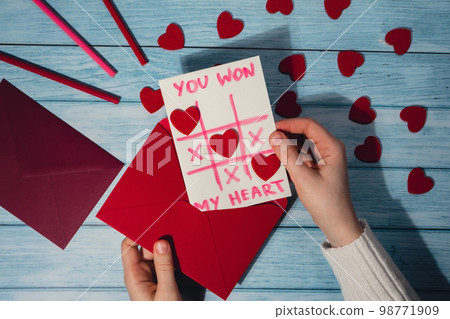 Valentines Day. Instructions for making valentine cards. Text YOU WON MY HEART and tic tac toe game Postcard craft, greeting card. DIY Step by step instruction. Making of handmade Valentine greeting Valentines Day. Instructions for making valentine cards. Text YOU WON MY HEART and tic tac toe game Postcard craft, greeting card. DIY Step by step instruction. Making of handmade Valentine greeting 98771909
