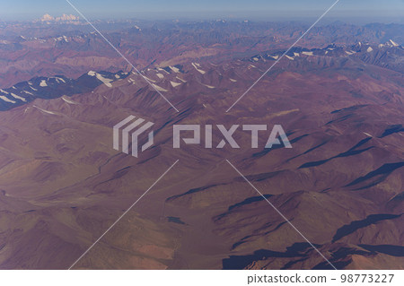View from the plane to the surface of the earth with a mountain landscape of the Himalayas at Ladakh, India 98773227
