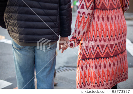 A couple sanding their hands in the streets of San Francisco A couple sanding their hands in the streets of San Francisco 98773557