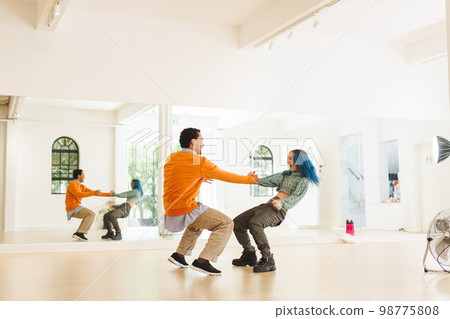Image of diverse female and male hip hop dancers during training in dance club Image of diverse female and male hip hop dancers during training in dance club 98775808