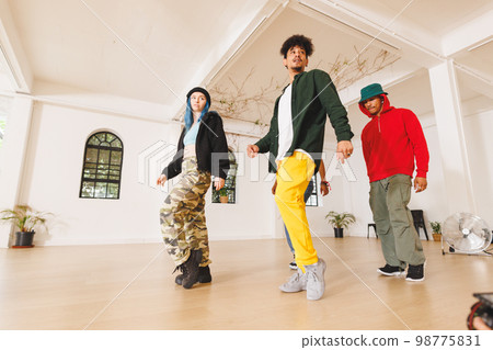 Image of group of group of diverse female and male hip hop dancers practicing in dance studio Image of group of group of diverse female and male hip hop dancers practicing in dance studio 98775831