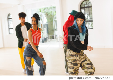 Image of group of group of diverse female and male hip hop dancers practicing in dance studio Image of group of group of diverse female and male hip hop dancers practicing in dance studio 98775832