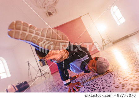 Image of biracial male hip hop dancer in studio 98775876