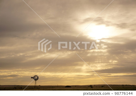 Plains, sunsets and windmills Plains, sunsets and windmills 98776144