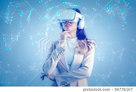 Asian businesswoman with VR headset looking at virtual reality screen. Business, technology, internet iot and networking concept.. 98776167