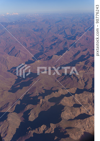 View from the plane to the surface of the earth with a mountain landscape of the Himalayas at Ladakh, India 98776243