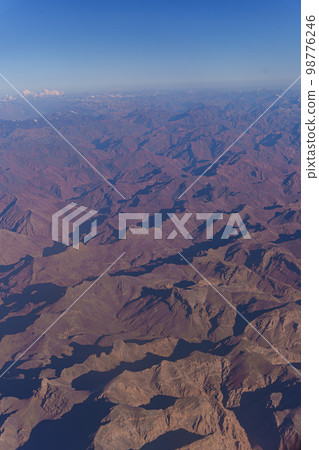 View from the plane to the surface of the earth with a mountain landscape of the Himalayas at Ladakh, India 98776246