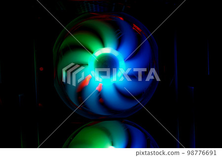 Colorful bright rainbow led rgb pc fan air case cooler. Computer chassis. Gaming modding, technology concept and IT background. Colorful bright rainbow led rgb pc fan air case cooler. Computer chassis. Gaming modding, technology concept and IT background. 98776691