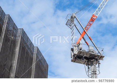 Construction site blue sky, frame and crane Construction site blue sky, frame and crane 98776980