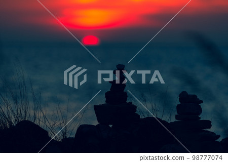 Zen concept. The object of the stones on the rock at sunset. Zen stones.. 98777074