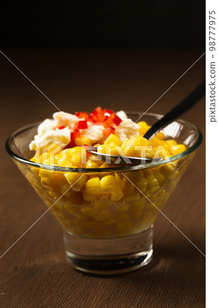 Esquites with corn, cheese, mayonnaise and chili. Mexican street food Esquites with corn, cheese, mayonnaise and chili. Mexican street food 98777975