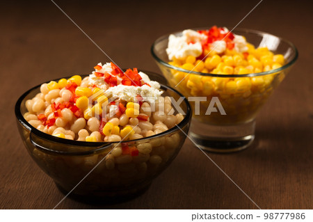 Esquites with corn and white kidney beans and chili. Mexican street food Esquites with corn and white kidney beans and chili. Mexican street food 98777986
