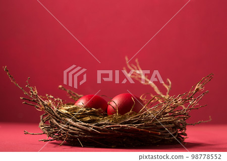 red eggs in a nest, copy space red eggs in a nest, copy space 98778552