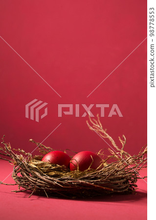 red eggs in a small nest, copy space red eggs in a small nest, copy space 98778553