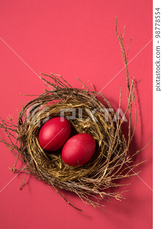Big red eggs in a small nest Big red eggs in a small nest 98778554