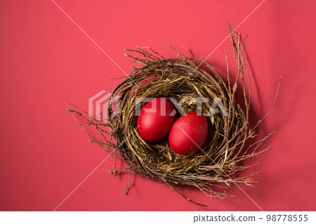 Big red eggs in a small nest Big red eggs in a small nest 98778555