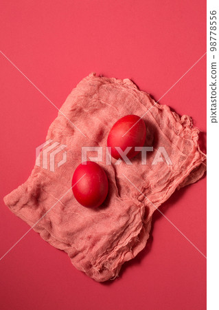 Pink chicken eggs on pink gauze on a pink background Pink chicken eggs on pink gauze on a pink background 98778556