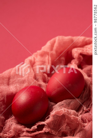 Pink chicken eggs on gauze on a pink Pink chicken eggs on gauze on a pink 98778562