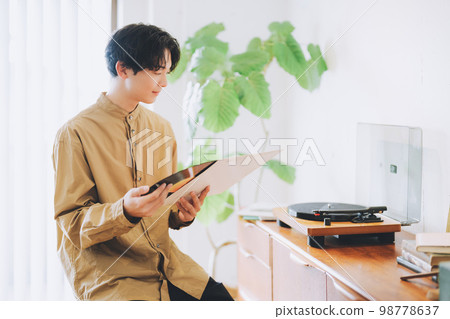 man listening to records 98778637