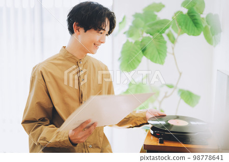man listening to records man listening to records 98778641