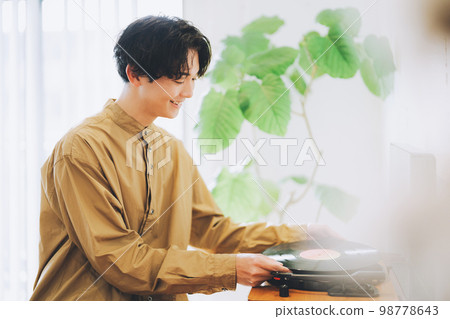 man listening to records 98778643