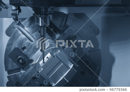 The 5-axis CNC milling machine cutting the automotive parts with ball end mill tool. The 5-axis CNC milling machine cutting the automotive parts with ball end mill tool. 98779366